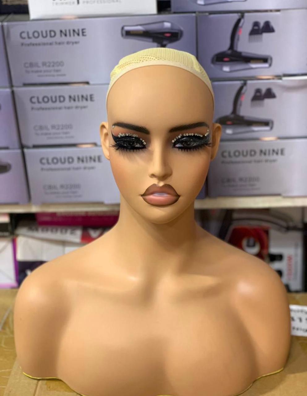 Weavon on a mannequin head